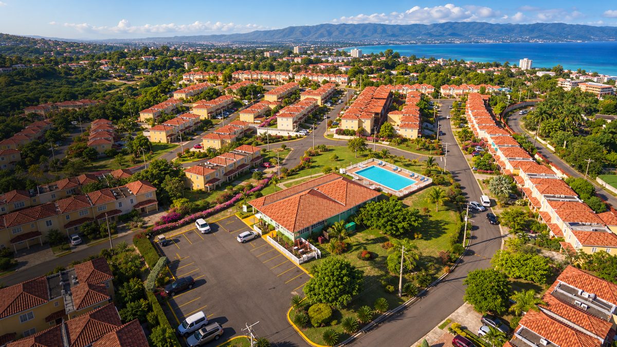 Aerial view of Mango Walk Country Club, its pool and the bay
